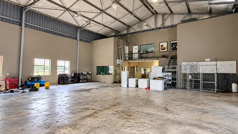 Bright Industrial Warehouse with Mezzanine Office.png