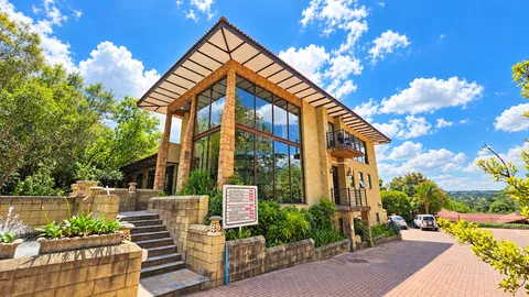 Sunlit Stone and Glass Spa Lodge (1).png